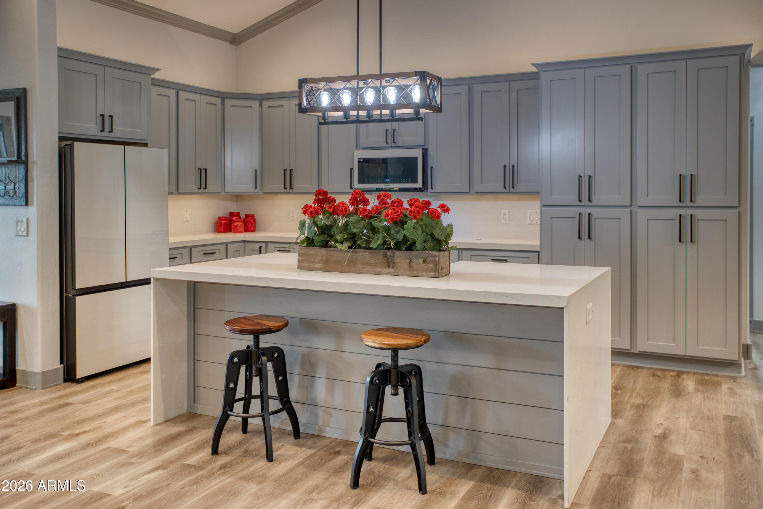 2281 West Edgewater Show Low, AZ 85901 - Photo 11 of 46 a kitchen with stainless steel appliances a dining table chairs and refrigerator