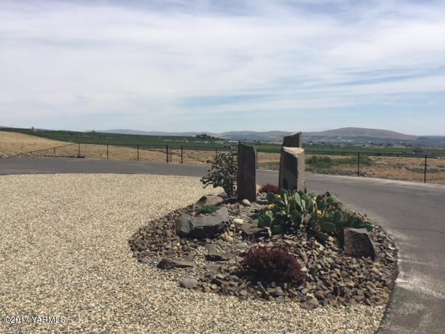 307 Warrior Road Yakima, WA 98901 - Photo 4 of 38 a view of a lake with a yard