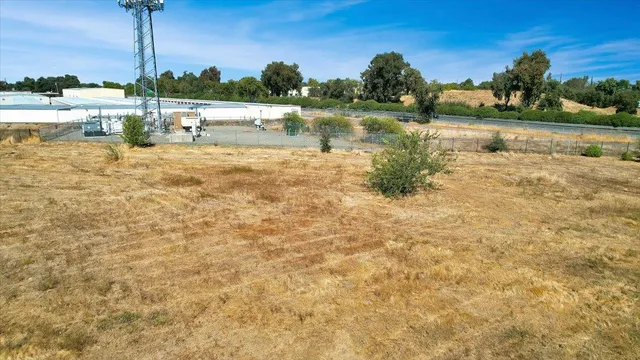 a view of a lake with houses in the back