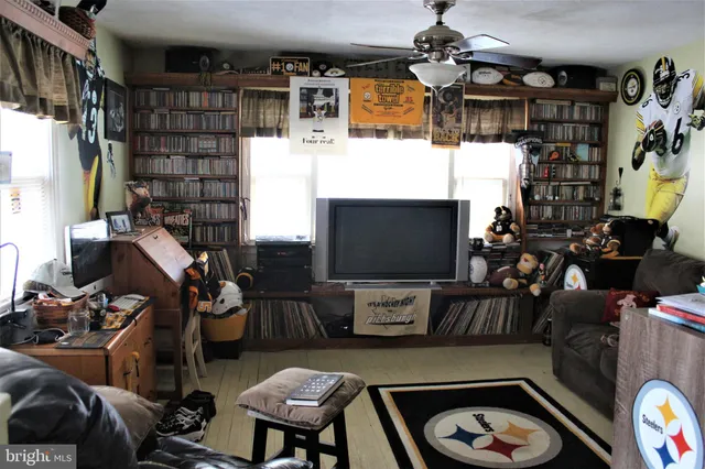 a room with furniture and a flat screen tv