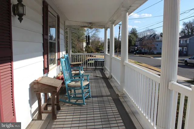 a balcony with chairs