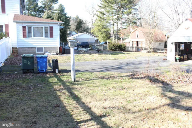 a view of a house with a yard covered in snow
