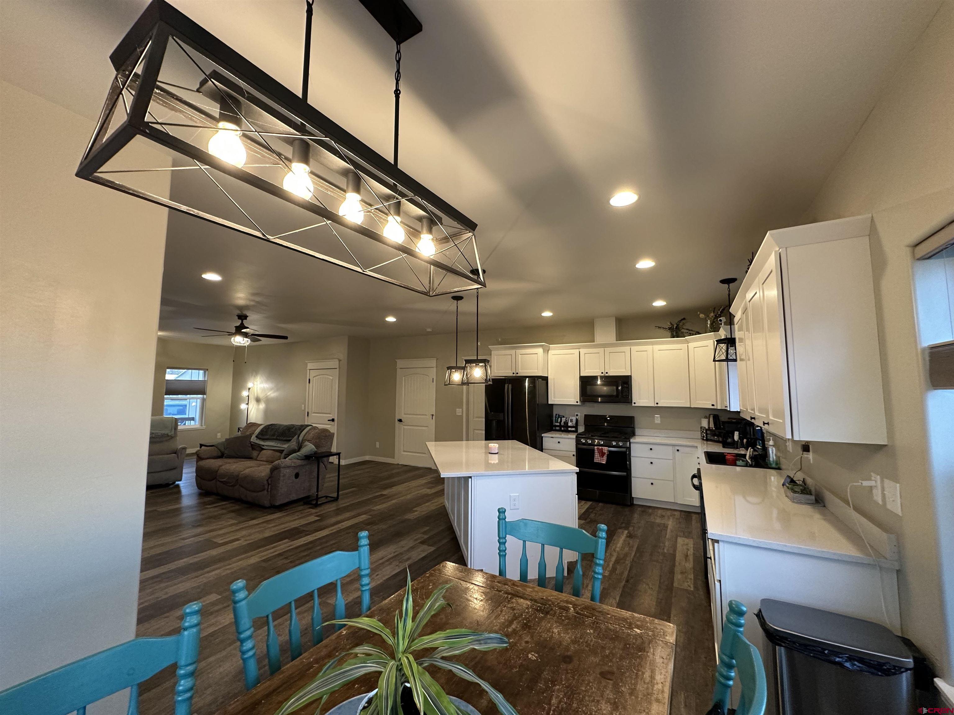 471 River Valley Court Delta, CO 81416 - Photo 14 of 31 a view of a dining room with furniture