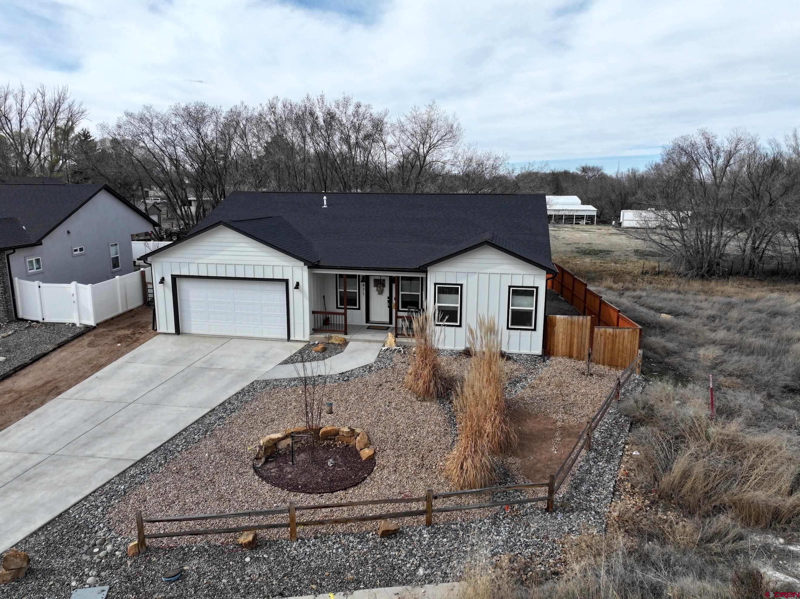 471 River Valley Court Delta, CO 81416 - Photo 2 of 31 a front view of a house with garden