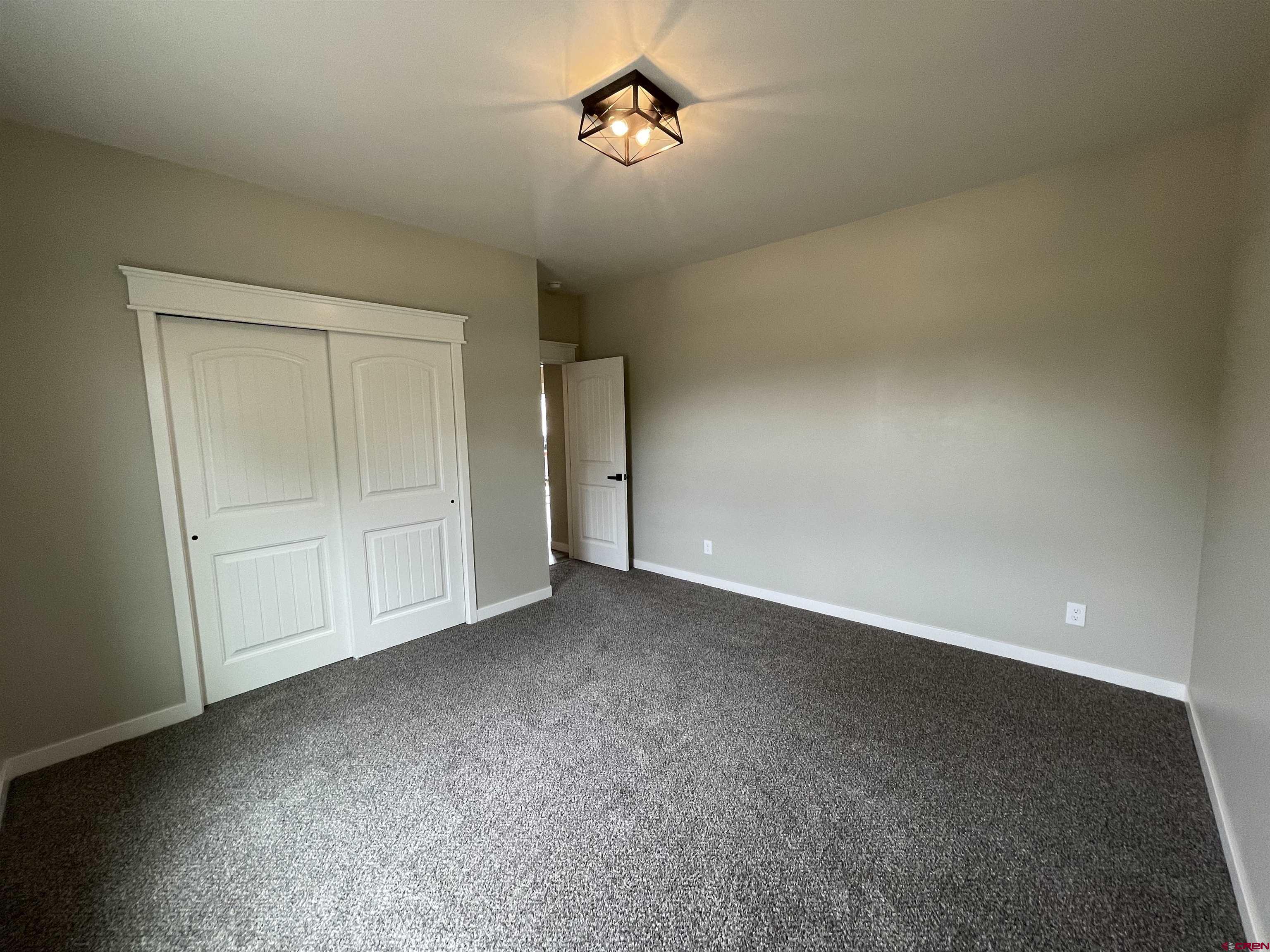 471 River Valley Court Delta, CO 81416 - Photo 25 of 31 a view of an empty room and chandelier fan