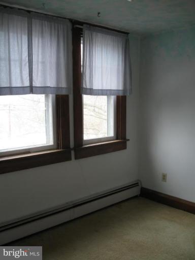 2121 White Hall Road White Hall, MD 21161 - Photo 13 of 20 a view of an empty room with a window