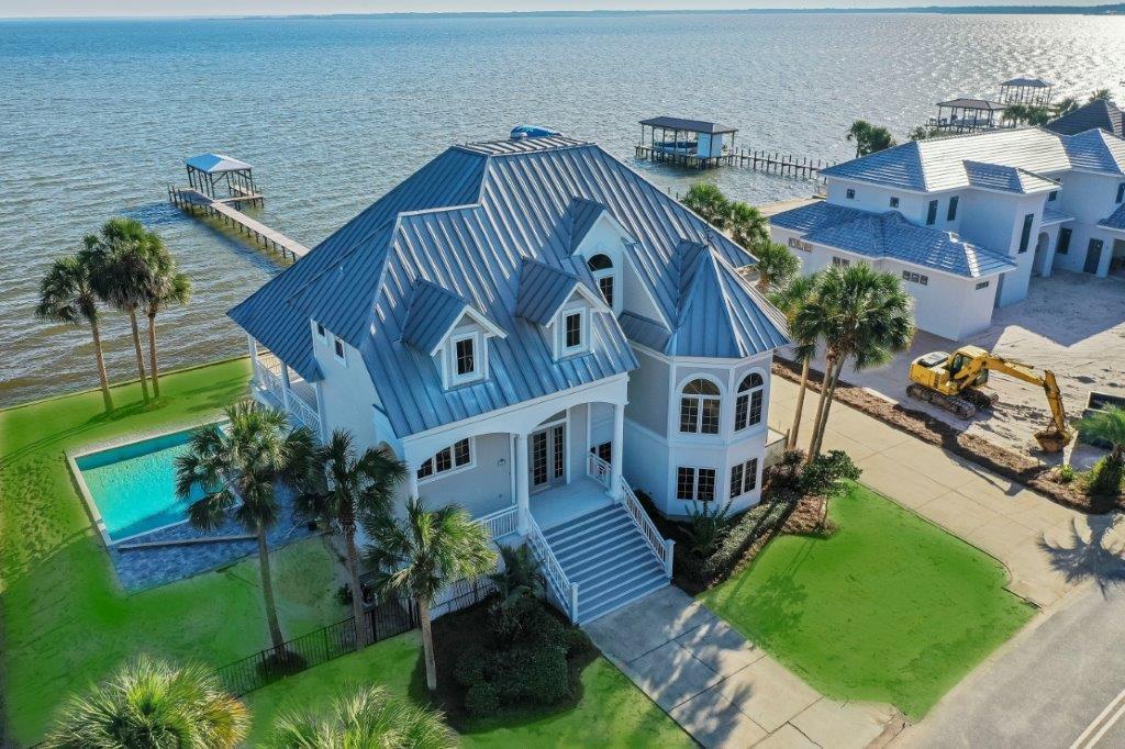 1669 Driftwood Point Road Santa Rosa Beach, FL 32459 - Photo 1 of 8 an aerial view of a house with a garden and plants