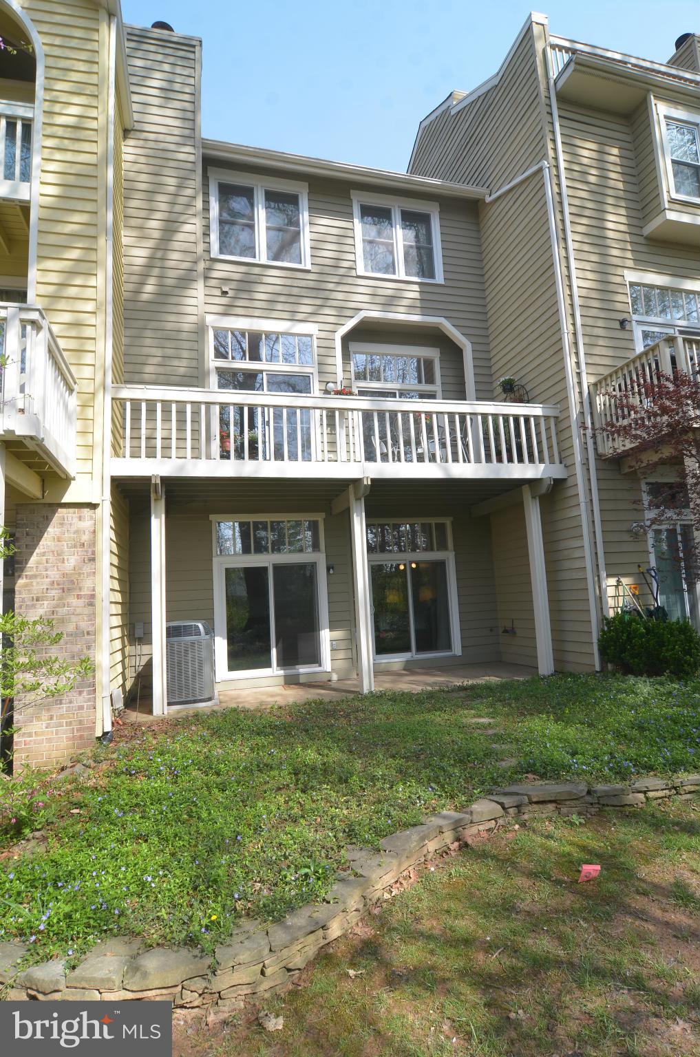 11125 Watermans Drive Reston, VA 20191 - Photo 25 of 26 The back landscaping has a stacked stone wall.