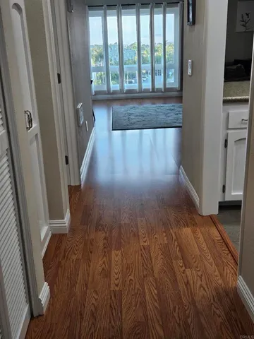 a view of entryway with wooden floor