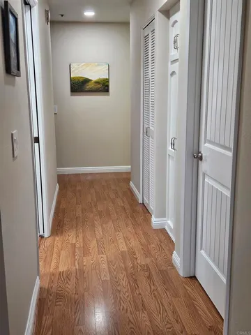 an entryway of a house with wooden floor
