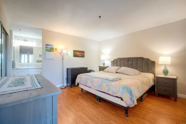 a bedroom with a bed and a dresser