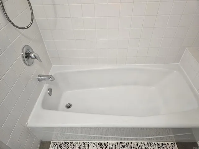a bathroom with a bath tub