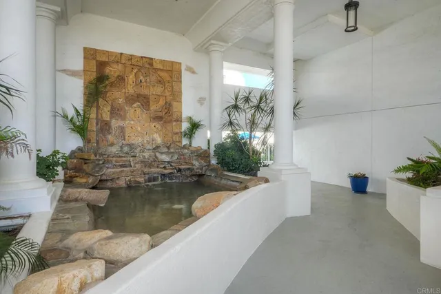 a view of a living room and a potted plant