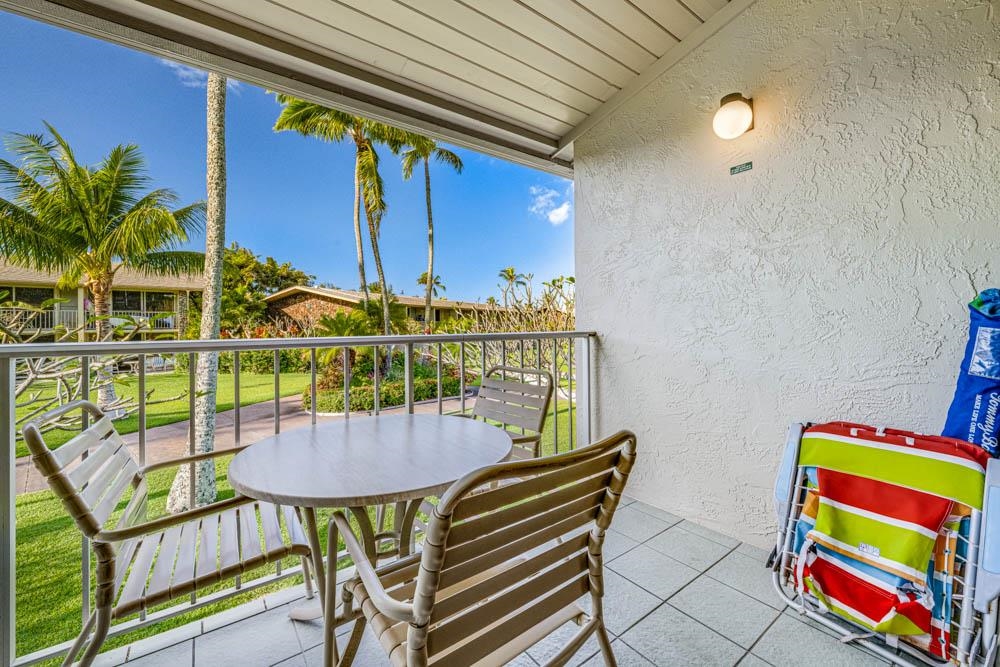 5315 Lower Honoapiilani Road, Unit C217 Lahaina, HI 96761 - Photo 12 of 26 a balcony with table and chairs