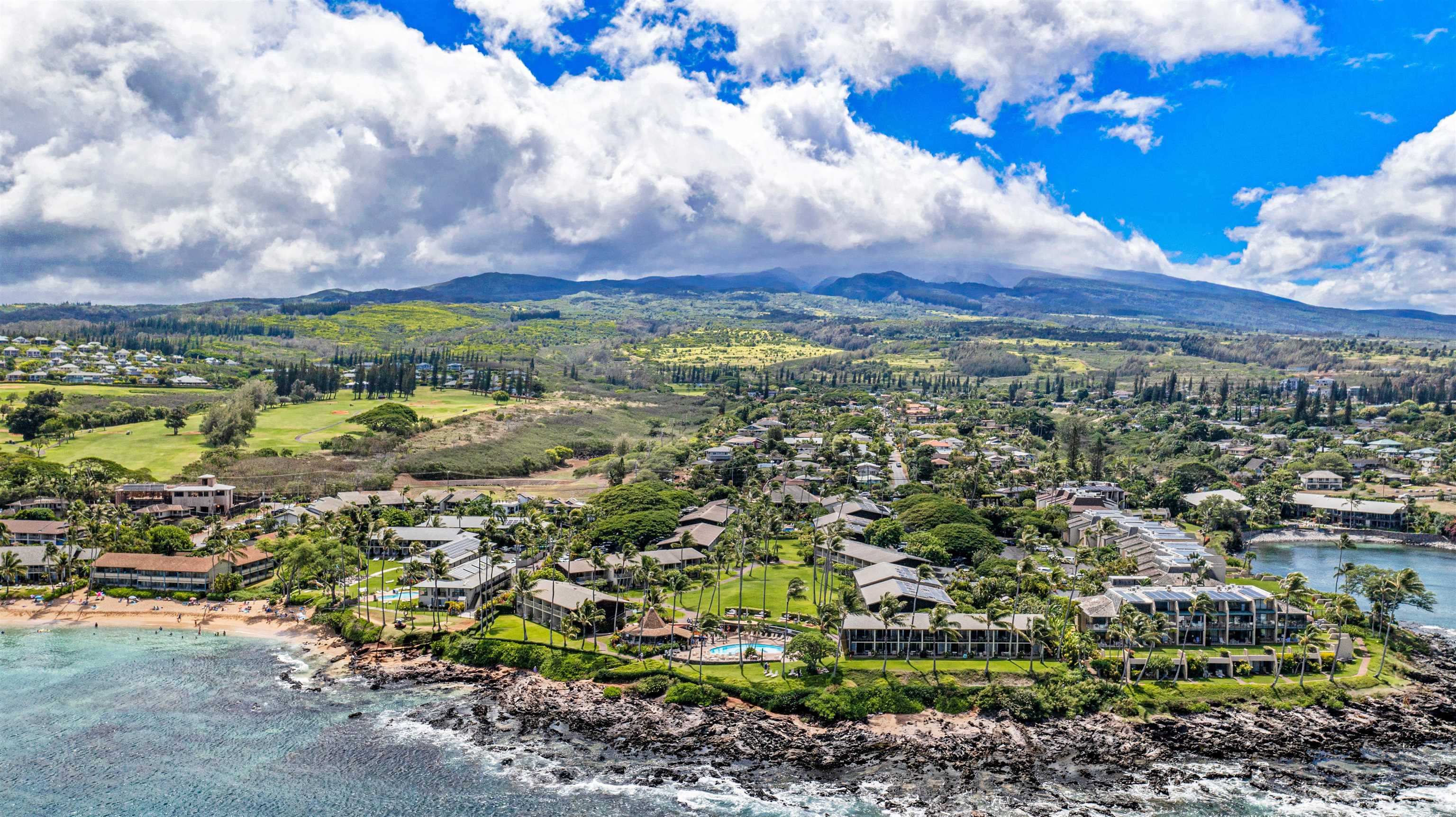5315 Lower Honoapiilani Road, Unit C217 Lahaina, HI 96761 - Photo 19 of 26 a view of a city with lush green forest