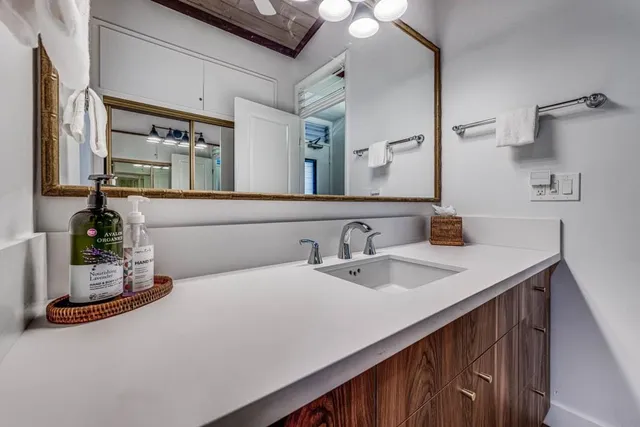 a bathroom with a sink and a mirror