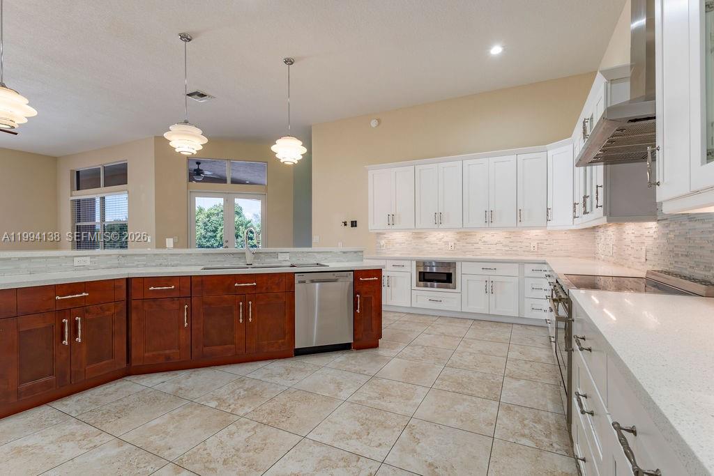 4800 Southwest 141st Avenue Miramar, FL 33027 - Photo 13 of 90 a kitchen with a sink and cabinets