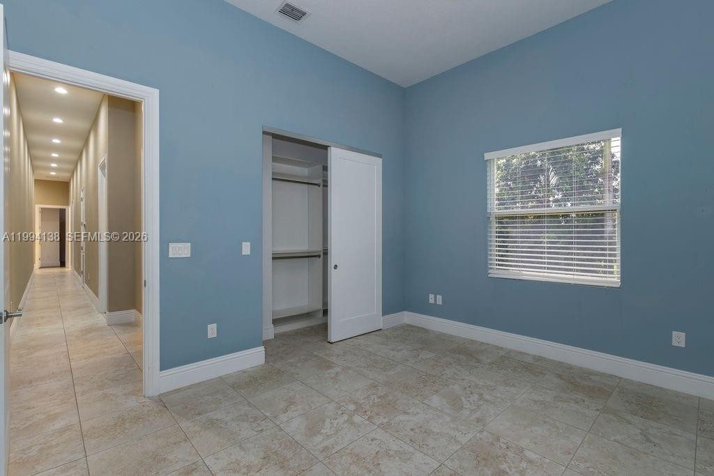 4800 Southwest 141st Avenue Miramar, FL 33027 - Photo 18 of 90 a view of an empty room with a window