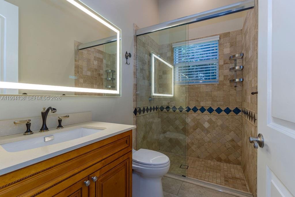 4800 Southwest 141st Avenue Miramar, FL 33027 - Photo 20 of 90 a bathroom with a sink toilet and shower