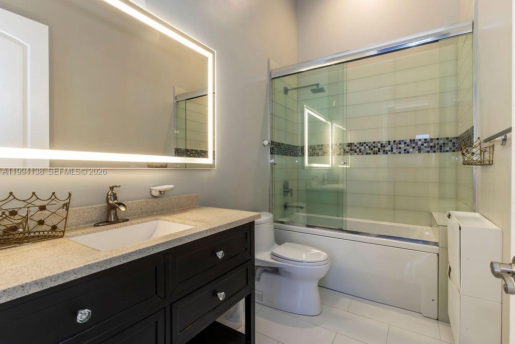 4800 Southwest 141st Avenue Miramar, FL 33027 - Photo 25 of 90 a bathroom with a sink a toilet and shower