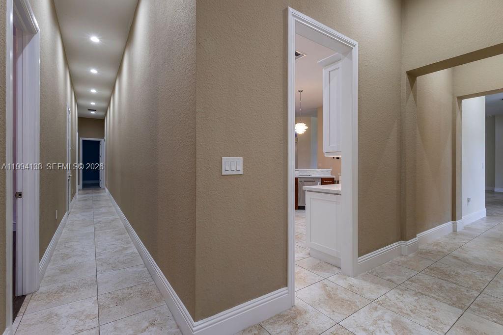 4800 Southwest 141st Avenue Miramar, FL 33027 - Photo 26 of 90 a view of a hallway with wooden shelves