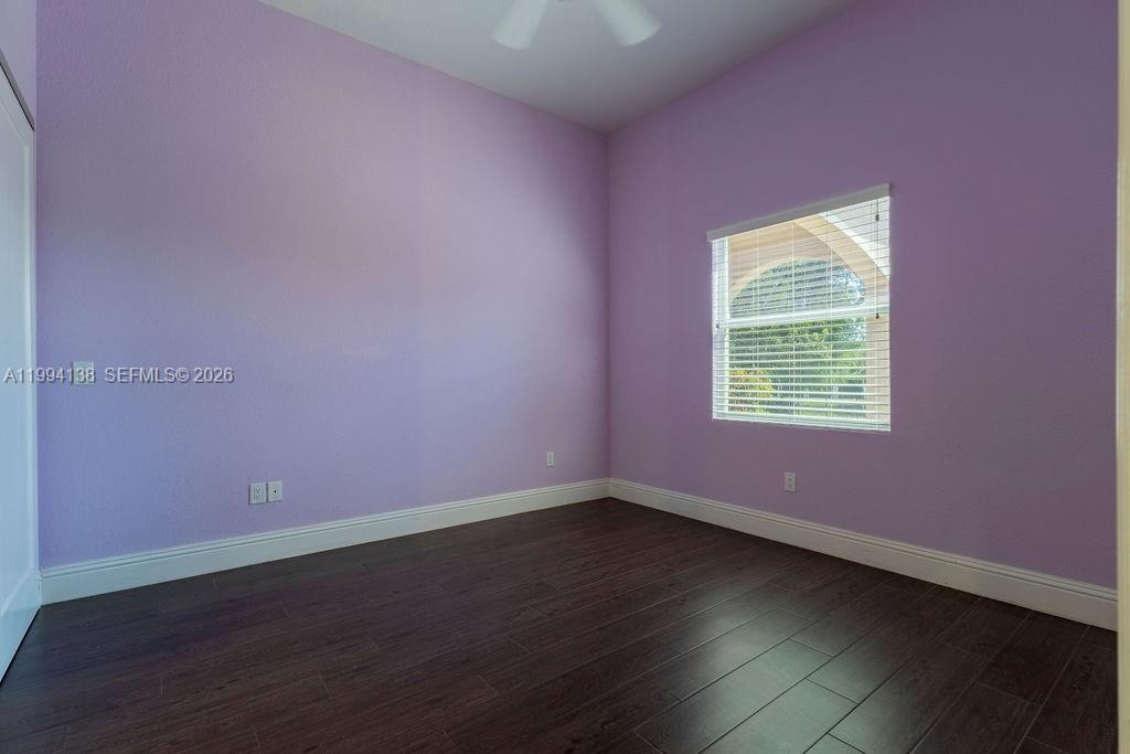 4800 Southwest 141st Avenue Miramar, FL 33027 - Photo 46 of 90 an empty room with wooden floor and windows