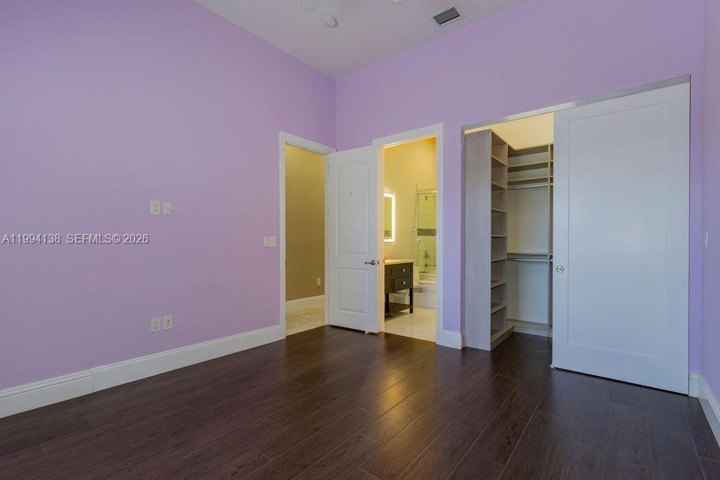 4800 Southwest 141st Avenue Miramar, FL 33027 - Photo 47 of 90 a big room with wooden floor and closet