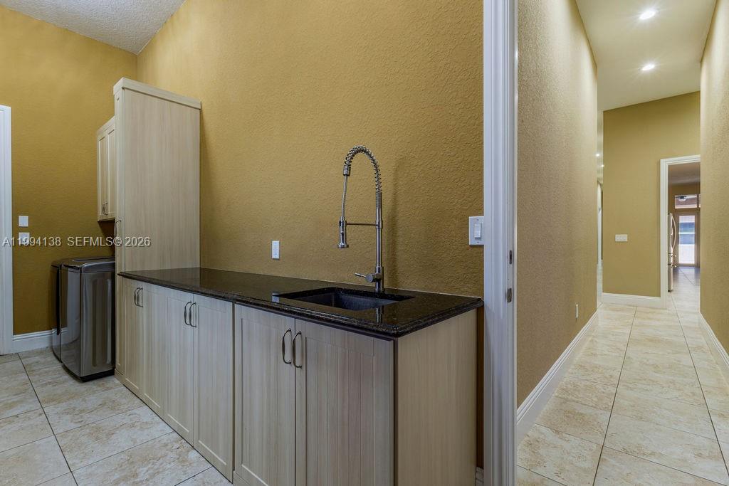 4800 Southwest 141st Avenue Miramar, FL 33027 - Photo 48 of 90 a bathroom with a sink and a mirror