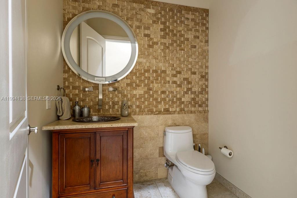 4800 Southwest 141st Avenue Miramar, FL 33027 - Photo 51 of 90 a bathroom with a toilet and a sink