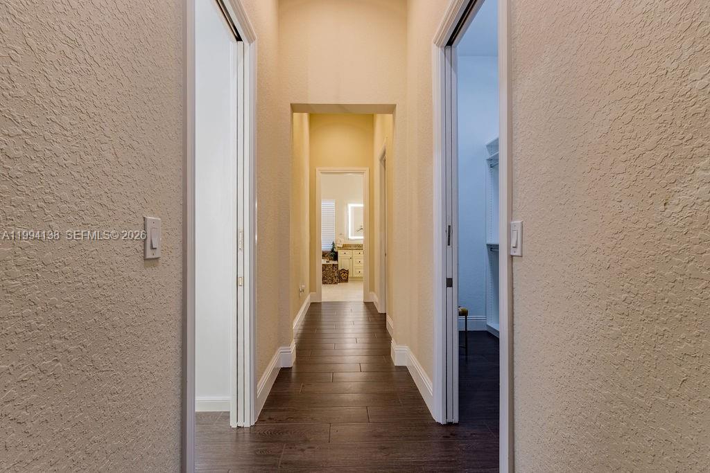 4800 Southwest 141st Avenue Miramar, FL 33027 - Photo 55 of 90 a view of a hallway with wooden floor