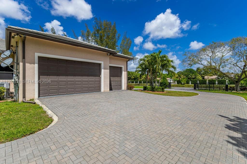 4800 Southwest 141st Avenue Miramar, FL 33027 - Photo 68 of 90 a view of a house with a yard and garage