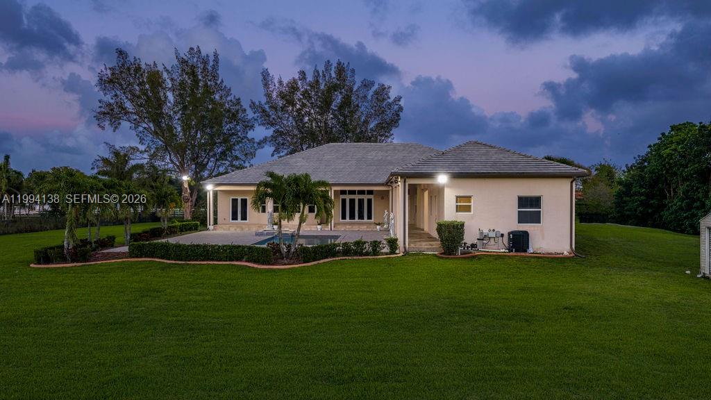 4800 Southwest 141st Avenue Miramar, FL 33027 - Photo 85 of 90 a front view of a house with a garden