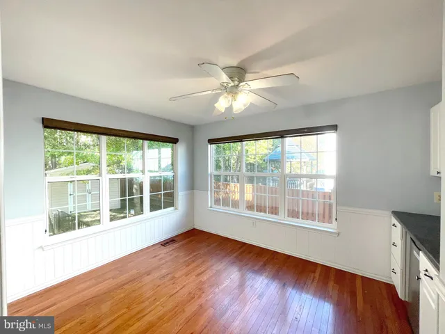 a kitchen with a stove and a shower