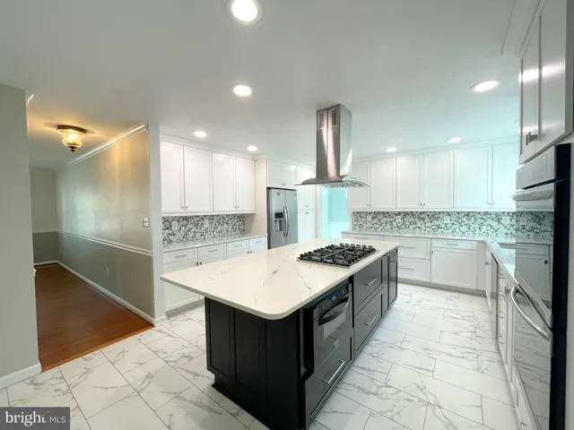 an empty room with a ceiling fan and a window