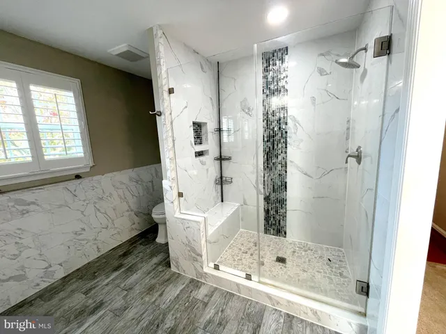 a large room with lots of wooden cabinets