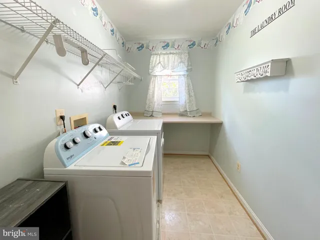 an empty room with a ceiling fan and entryway