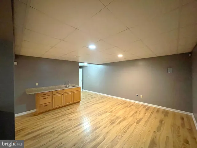 a bathroom with a toilet and a mirror