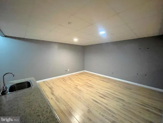 a bathroom with a white bath tub and a shower