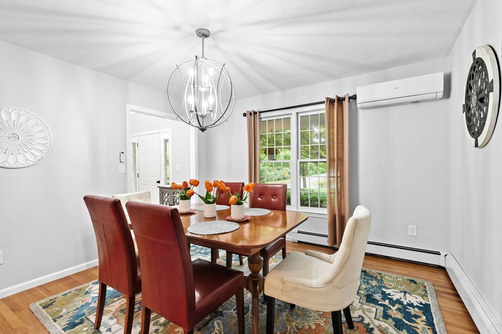 21 Chowdermarch Street Marshfield, MA 02050 - Photo 17 of 39 a view of a dining room with furniture window and wooden floor