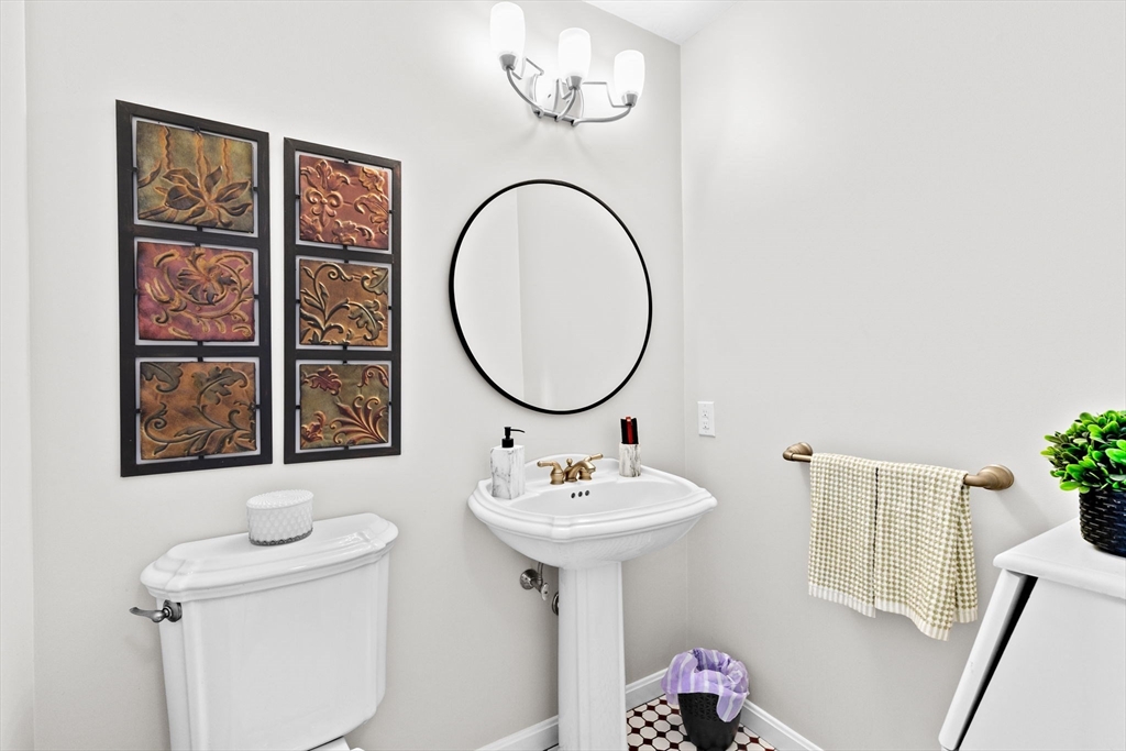 21 Chowdermarch Street Marshfield, MA 02050 - Photo 19 of 39 a bathroom with a sink a mirror and a window