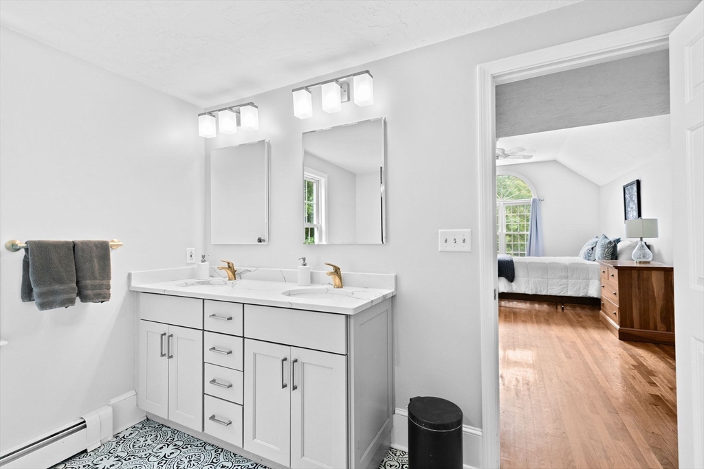21 Chowdermarch Street Marshfield, MA 02050 - Photo 22 of 39 a en suite bathroom with a toilet sink and mirror