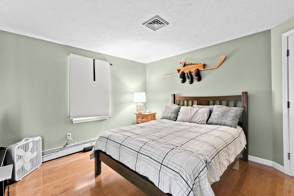 21 Chowdermarch Street Marshfield, MA 02050 - Photo 24 of 39 a bedroom with a bed and a window