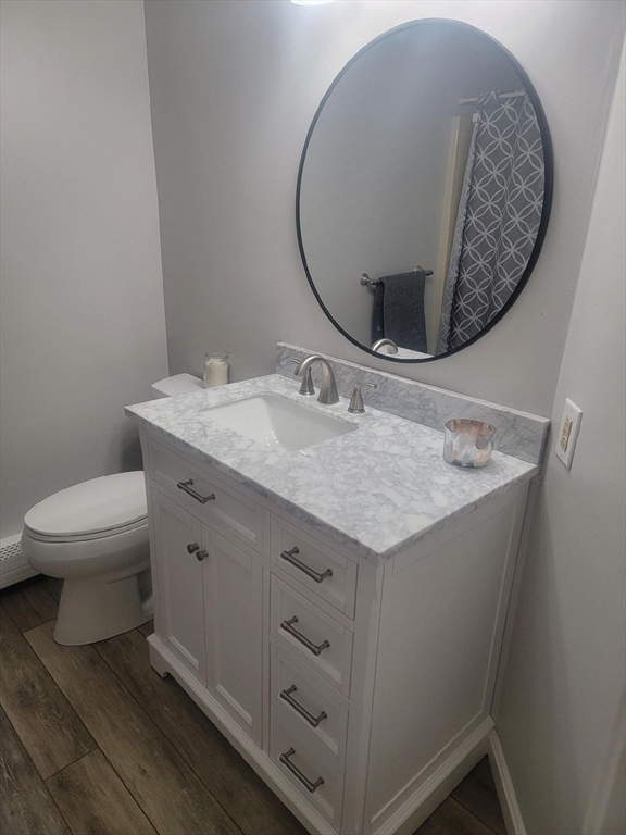 21 Chowdermarch Street Marshfield, MA 02050 - Photo 30 of 39 a bathroom with a granite countertop sink and a mirror
