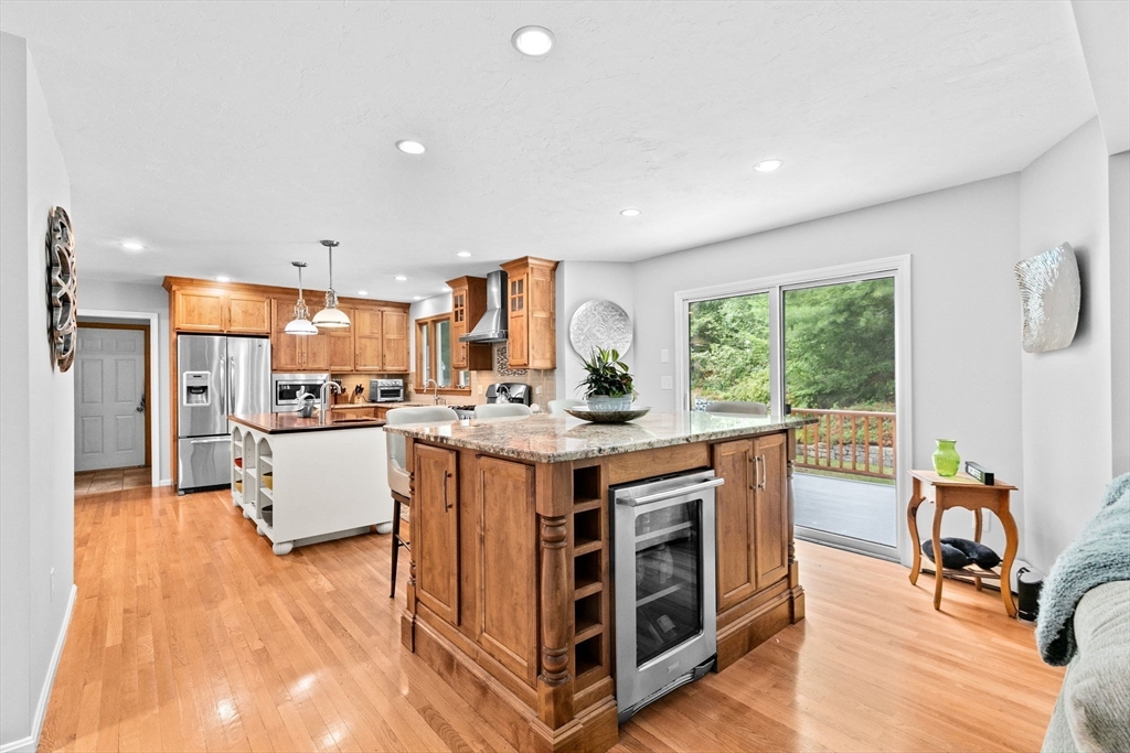 21 Chowdermarch Street Marshfield, MA 02050 - Photo 3 of 39 a open kitchen with stainless steel appliances granite countertop a lot of counter space and wooden floors