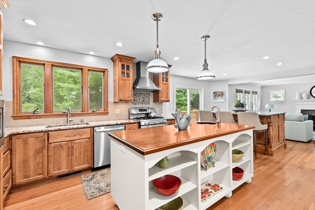 21 Chowdermarch Street Marshfield, MA 02050 - Photo 7 of 39 a large kitchen with kitchen island a large island in it