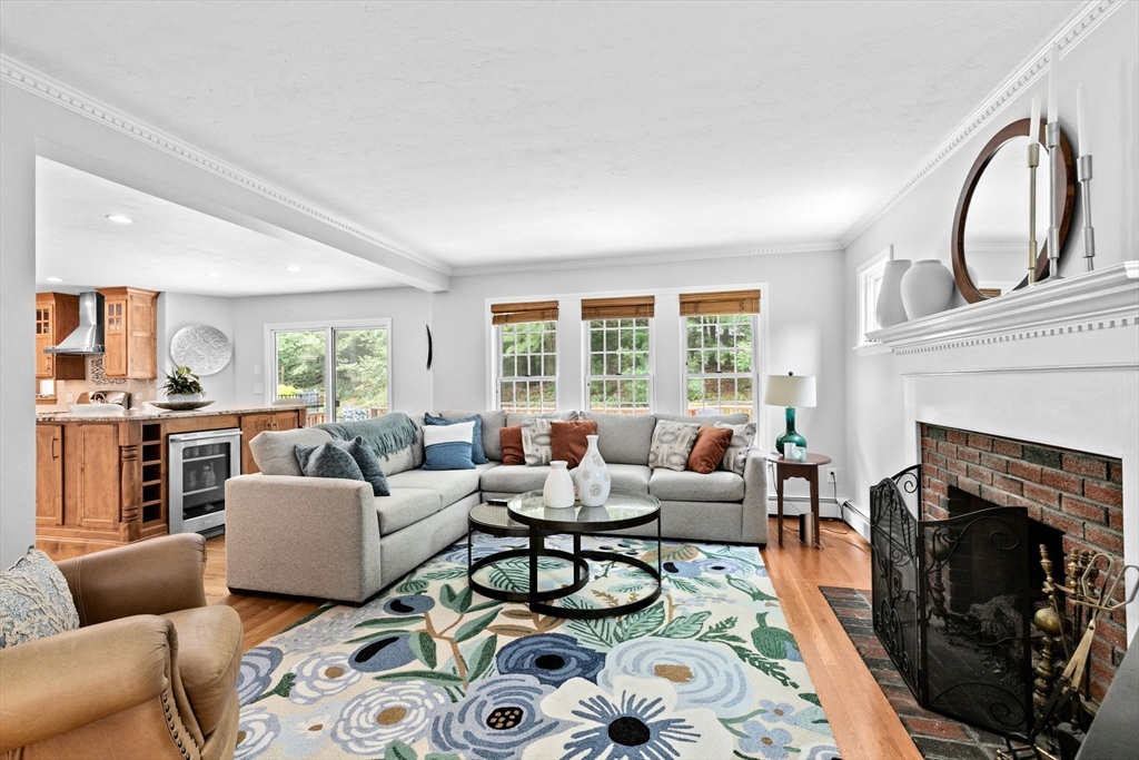 21 Chowdermarch Street Marshfield, MA 02050 - Photo 10 of 39 a living room with furniture and a fireplace