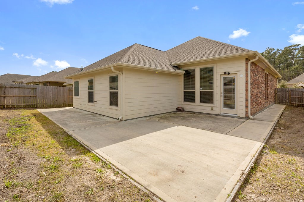 2666 Cedar Path Lane Conroe, TX 77385 - Photo 20 of 22 a front view of a house with a yard