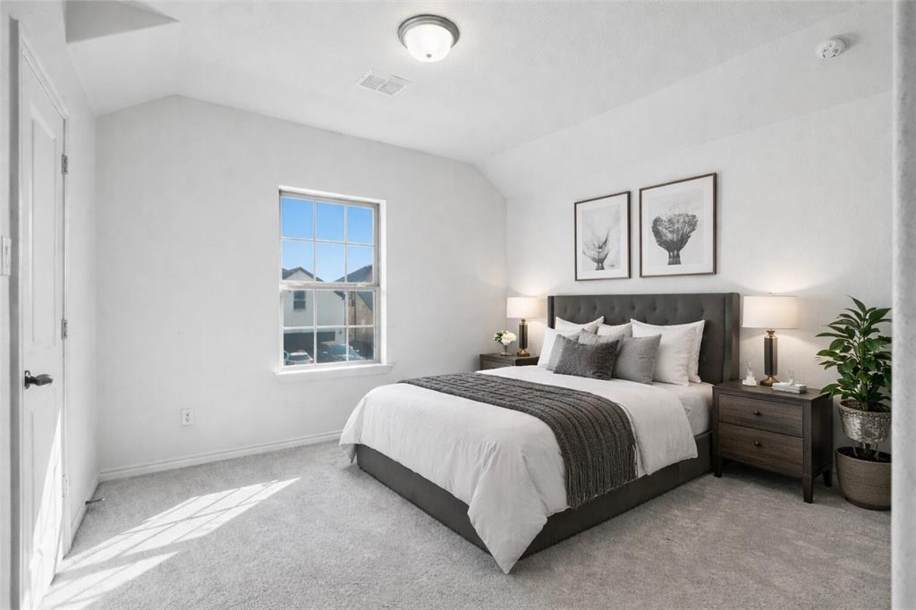 537 Oakmoss Street Little Elm, TX 76227 - Photo 20 of 39 a bedroom with a bed and a window