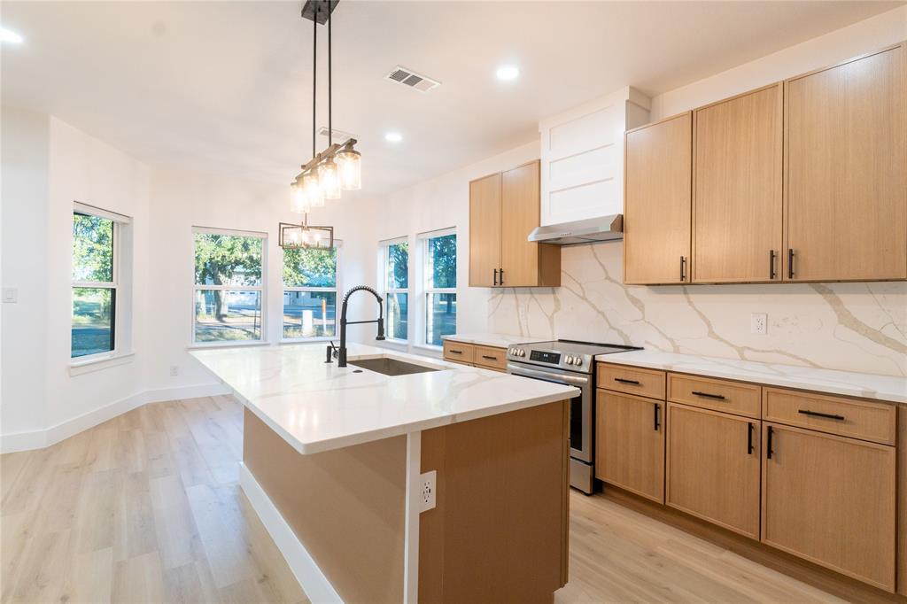 6131 Inca Drive Mabank, TX 75156 - Photo 5 of 21 a kitchen with a sink a window and cabinets