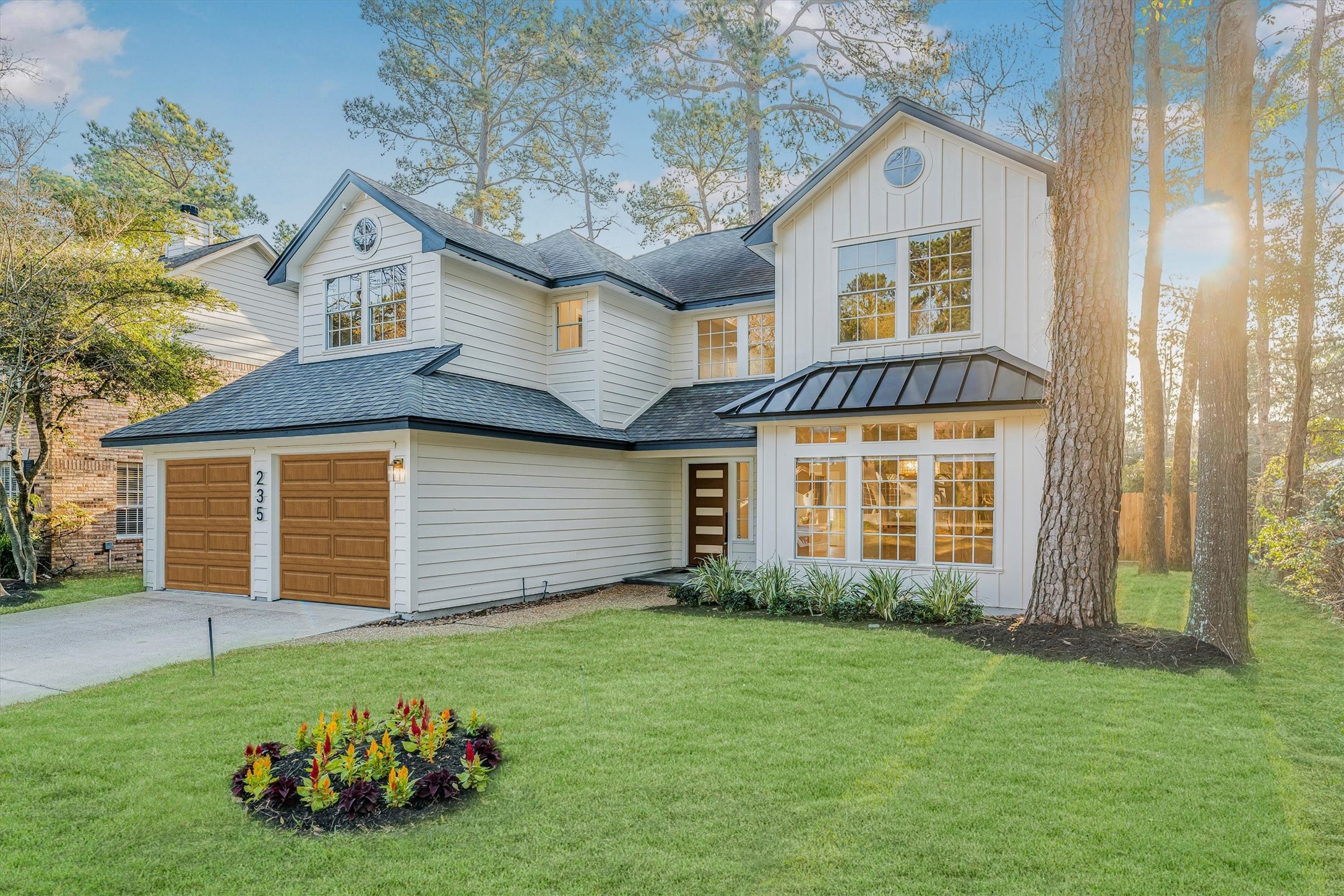 a front view of a house with a garden